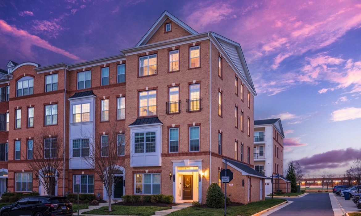 Front photo of a brick end-unit townhouse in Ashburn, sold by top real estate agent Jean Garrell