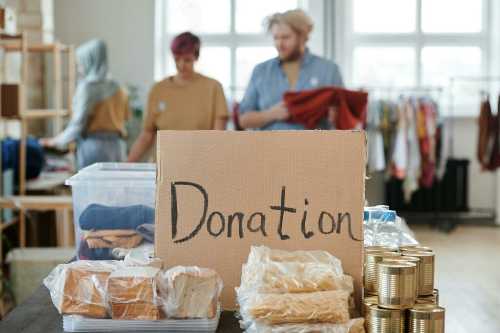 A cardboard box filled with donated items, symbolizing charitable donations and volunteer opportunities in Loudoun County. The image represents the community's efforts to support local nonprofits and help those in need through various donation drives and volunteer activities.