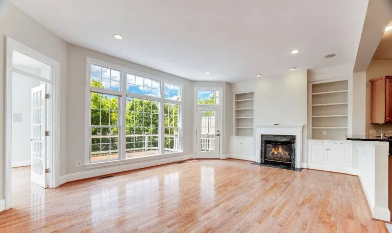 Interior living room with fireplace lit, no furniture, showing different ways you can sell a home in Leesburg and understand your home worth