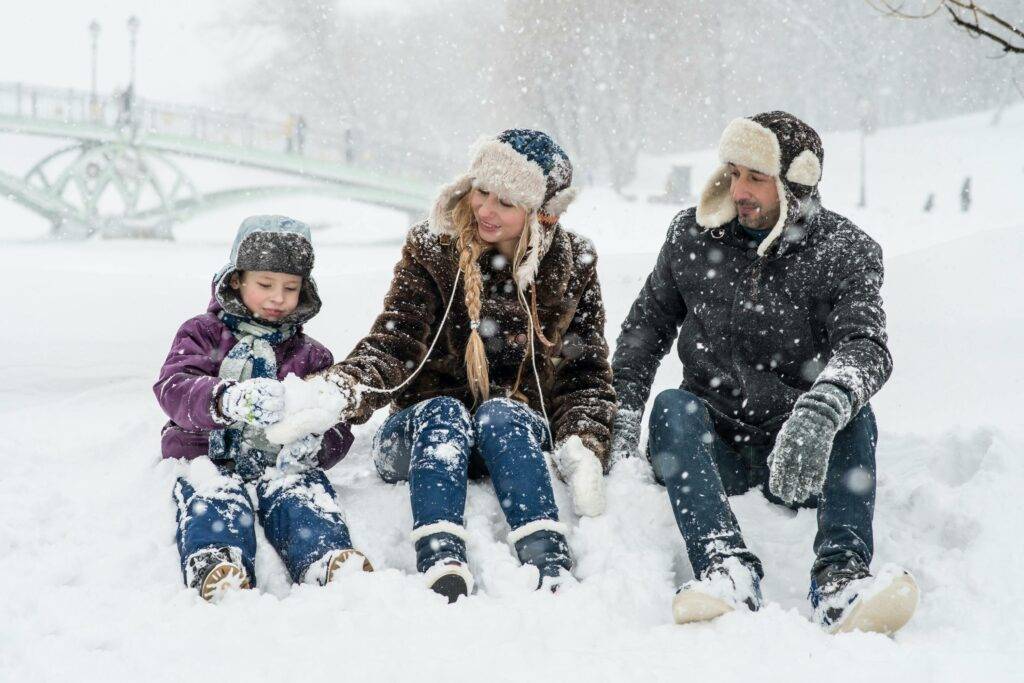 Family plays in the snow for winter activities in Leesburg Virginia