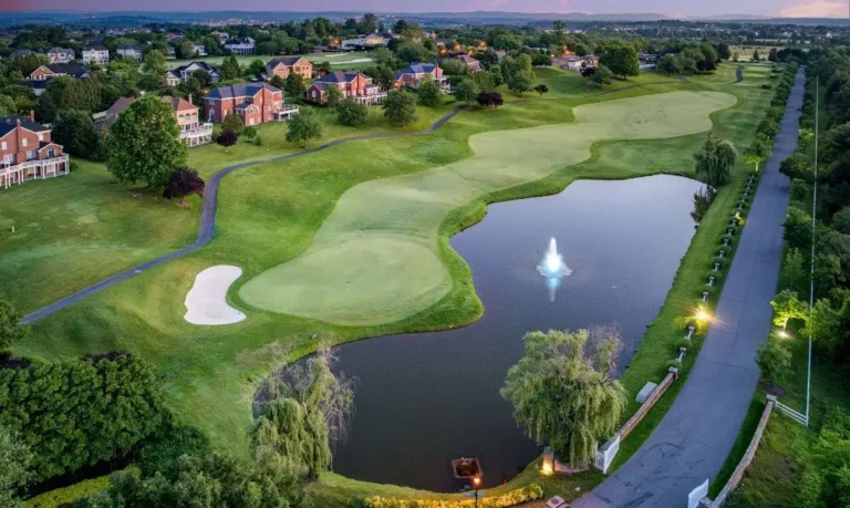 Aerial photo of golf course and luxury townhomes in Ashburn sold by best realtors Garrell Group